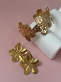 elegante: Eterna Flor – Set pulsera con aretes.